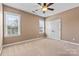 Bedroom featuring multiple windows with blinds and a double door closet at 1016 Filly Dr, Indian Trail, NC 28079