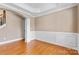 Formal dining room with hardwood floors, decorative molding, and neutral paint at 1016 Filly Dr, Indian Trail, NC 28079