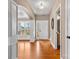 Welcoming foyer with gleaming hardwood floors, an arched doorway and ample natural light at 1016 Filly Dr, Indian Trail, NC 28079