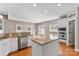 This kitchen features granite countertops, stainless appliances, and custom white cabinetry at 1016 Filly Dr, Indian Trail, NC 28079
