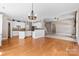 Open kitchen featuring white cabinetry, granite countertops and stainless steel appliances at 1016 Filly Dr, Indian Trail, NC 28079