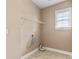 Laundry room featuring a window and tile flooring at 1016 Filly Dr, Indian Trail, NC 28079
