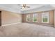 Main bedroom featuring multiple windows and carpet at 1016 Filly Dr, Indian Trail, NC 28079