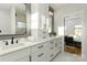 Bright main bathroom featuring double sinks, quartz counters and marble floors at 106 Isle Of Pines Rd, Mooresville, NC 28117