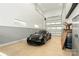 Sleek garage featuring a modern black car with a car lift at 106 Isle Of Pines Rd, Mooresville, NC 28117