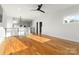 Open-concept living area featuring hardwood floors and modern design elements at 106 Isle Of Pines Rd, Mooresville, NC 28117