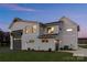 Striking rear view of a white two-story home with a well-manicured lawn and attached garage at 106 Isle Of Pines Rd, Mooresville, NC 28117