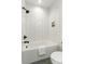 Clean bathroom with white subway tile in a herringbone pattern and black hardware at 108 Isle Of Pines Rd # 3, Mooresville, NC 28117