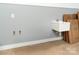 Functional utility sink in garage with gray walls and white trim at 108 Isle Of Pines Rd # 3, Mooresville, NC 28117