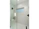 Modern glass-enclosed shower with marble tile and a built-in bench at 108 Isle Of Pines Rd # 3, Mooresville, NC 28117