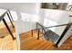 Wooden staircase with black railing, leading down to the lower level of the house at 108 Isle Of Pines Rd # 3, Mooresville, NC 28117
