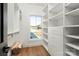 Walk-in closet with custom shelving and a large window at 108 Isle Of Pines Rd # 3, Mooresville, NC 28117