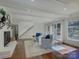 Bright living room with hardwood floors, neutral paint, a fireplace, and French doors to the backyard at 123 Old Bell Rd, Charlotte, NC 28270