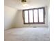 Bright bedroom with a large diamond pane window, providing ample natural light and a cozy ambiance at 13062 Highway 55 W Hwy, York, SC 29745