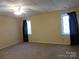 Spacious bedroom with plush carpet and natural light from two windows at 13062 Highway 55 W Hwy, York, SC 29745
