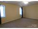 Spacious bedroom with plush carpet and natural light from two windows at 13062 Highway 55 W Hwy, York, SC 29745