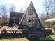 Charming A-frame home with a large deck perfect for outdoor relaxation and enjoying the natural surroundings at 13062 Highway 55 W Hwy, York, SC 29745