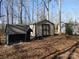 Exterior view of multiple storage sheds on a wooded lot at 13062 Highway 55 W Hwy, York, SC 29745