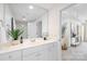 Bright bathroom boasts a large mirror, modern vanity, and a view into the adjacent living space at 1320 Fillmore St # 419, Charlotte, NC 28203