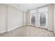 A bedroom with two windows which allow an abundance of natural light at 1320 Fillmore St # 419, Charlotte, NC 28203