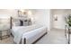 A serene main bedroom with a large bed, soft lighting, and access to a walk-in closet at 1320 Fillmore St # 419, Charlotte, NC 28203