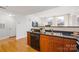 Kitchen featuring stainless steel sink and appliances, dark countertop and wood cabinets at 1320 Fillmore St # 419, Charlotte, NC 28203
