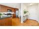 Stylish condo featuring an open kitchen with wood cabinets, granite countertops, and stainless steel appliances at 1320 Fillmore St # 419, Charlotte, NC 28203