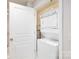 Compact laundry area features a stacked washer and dryer, optimizing space in this efficiently designed home at 1320 Fillmore St # 419, Charlotte, NC 28203