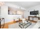 Cozy living area featuring an open concept design, wood floors, and contemporary decor at 1320 Fillmore St # 419, Charlotte, NC 28203