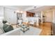 A stylish open-concept layout with a modern living area leading into the kitchen and dining room at 1320 Fillmore St # 419, Charlotte, NC 28203