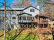 Two-story home with a tiered wood deck at 13424 Portside Ct, Charlotte, NC 28278