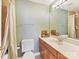 Well-maintained bathroom featuring a single vanity with storage, shower/tub, and neutral color scheme at 13424 Portside Ct, Charlotte, NC 28278