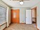 Neutral bedroom featuring carpet, standard closet, and a bright window with blinds and curtains at 13424 Portside Ct, Charlotte, NC 28278