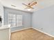 Simple bedroom with carpet flooring, ceiling fan, and natural light from the window at 13424 Portside Ct, Charlotte, NC 28278