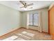 Cozy bedroom with a ceiling fan, carpet flooring, and natural light from the window at 13424 Portside Ct, Charlotte, NC 28278