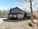 Charming home with stone facade, inviting front yard, and a detached garage nearby at 13424 Portside Ct, Charlotte, NC 28278