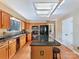 Bright kitchen featuring wooden cabinets, granite countertops and stainless steel appliances at 13424 Portside Ct, Charlotte, NC 28278