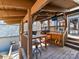 Outdoor kitchen and grilling space with natural wood beams and seating at 13424 Portside Ct, Charlotte, NC 28278