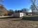 Open backyard with a utility building, offering plenty of space for storage or hobbies at 1415 S Morgan St, Shelby, NC 28152