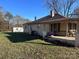 Classic home featuring a covered porch, chimney, and a spacious side yard at 1415 S Morgan St, Shelby, NC 28152