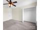 Bedroom featuring a ceiling fan and walk-in closet at 1432 Astoria Nw Ln, Concord, NC 28027