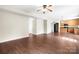 Open-concept living room with hardwood floors seamlessly flowing into the kitchen at 1432 Astoria Nw Ln, Concord, NC 28027