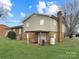 Spacious backyard with a covered patio area, ideal for outdoor relaxation at 1465 Earl St, Hickory, NC 28602