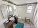 Cozy bathroom with updated vanity, mirror, and natural light from window at 1465 Earl St, Hickory, NC 28602