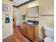 Well-lit bathroom features wood floors, decorative accents, and a classic wooden vanity at 1465 Earl St, Hickory, NC 28602