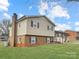 Well-maintained exterior showcasing a classic design with a combination of brick and siding at 1465 Earl St, Hickory, NC 28602
