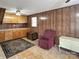 Versatile living room with built-ins and a comfortable seating area with wood paneling at 1465 Earl St, Hickory, NC 28602