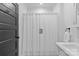 White bathroom features a pedestal sink, medicine cabinet, and shower with curtain at 1517 Cleveland Ave # D, Charlotte, NC 28203
