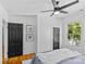 Bright bedroom features hardwood floors, ceiling fan and a sunny window view at 1517 Cleveland Ave # D, Charlotte, NC 28203
