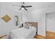 Cozy bedroom features hardwood floors, a neutral color palette, and a ceiling fan at 1517 Cleveland Ave # D, Charlotte, NC 28203